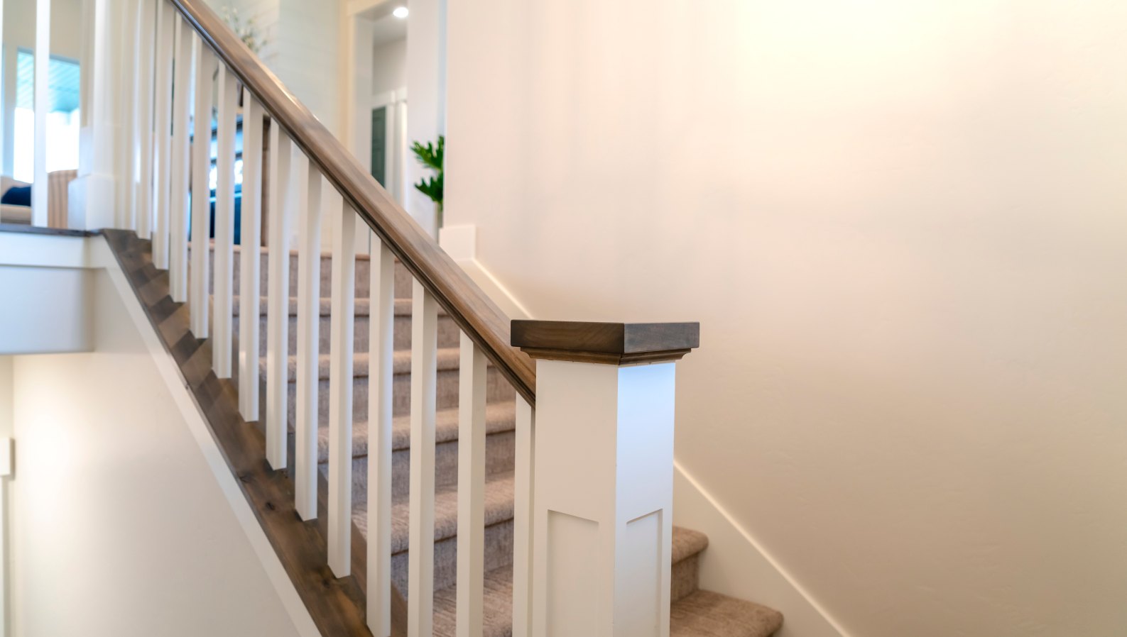 A home staircase with a sturdy handrail for senior safety